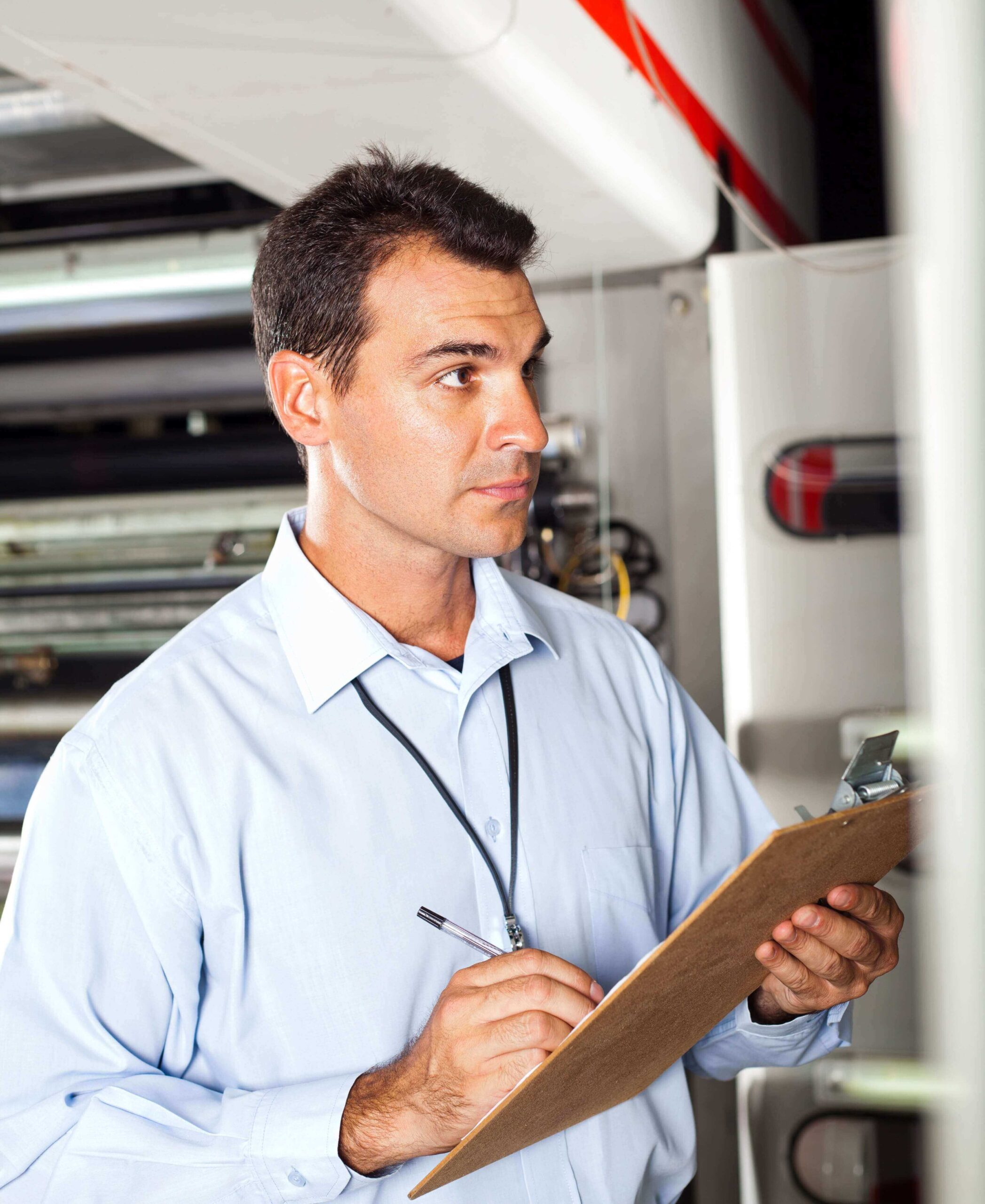 industrial technician taking machine readings